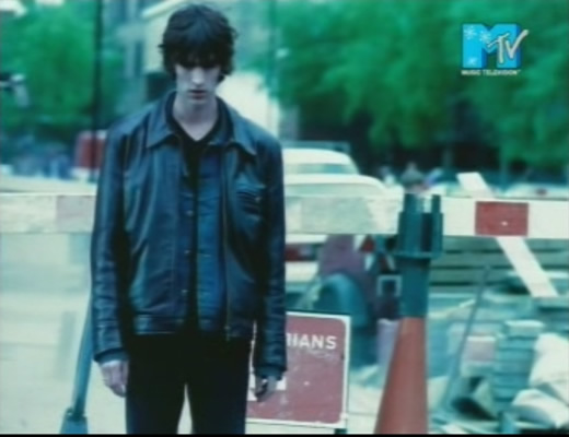 Richard standing in front of the Golden Fried Chicken shop at the start of the video