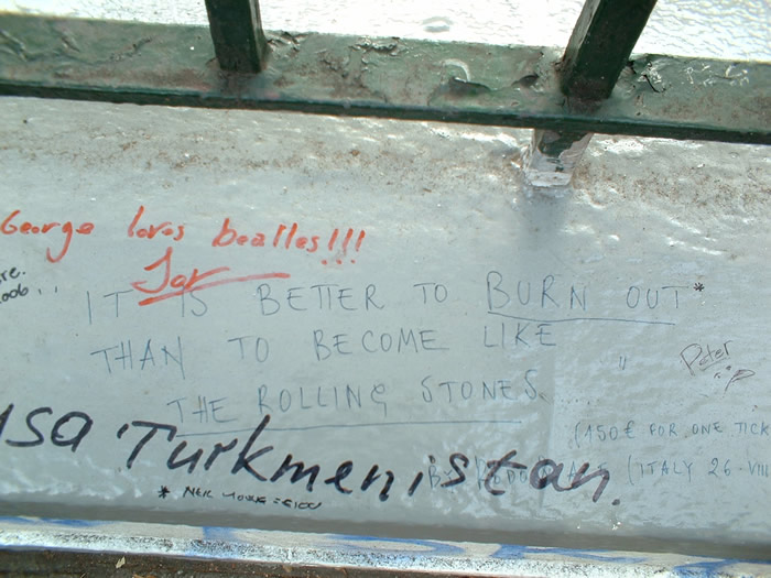 Graffiti centre reads: Its better to burn out than become like the Rolling Stones