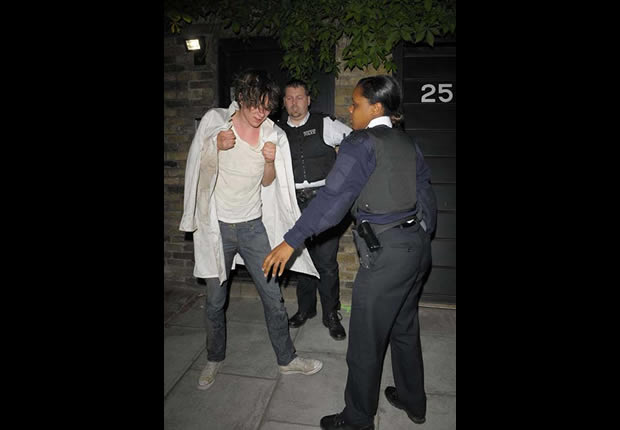 Kristian Marr being arrested by police after sleeping in Amy Winehouse garage May 2008.