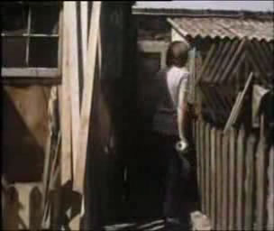 The outhouse in the video remains unidentified