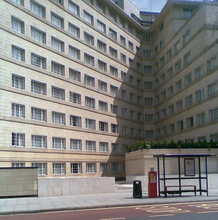 Opposite side of the street looking right, a block of flats.