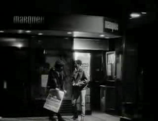 The start of the video for "I'm your man", outside of the Marquee, sign visible 