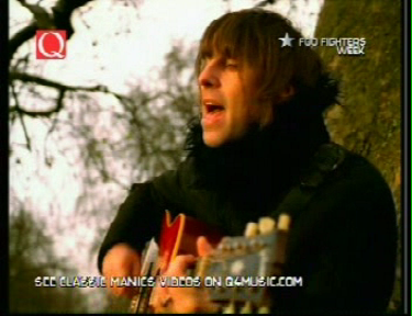 Liam under a tree in the video for Songbird 